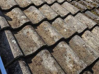 Roof tiles cleared of moss and back to their own colour