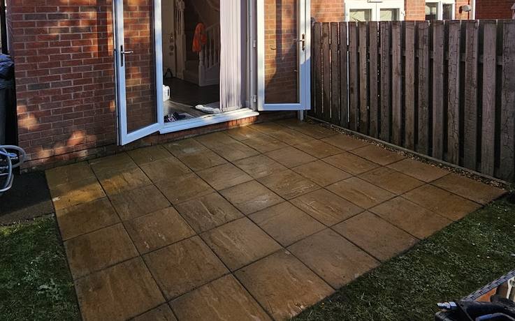 Indian sandstone patio cleaned back to a warm buff colour